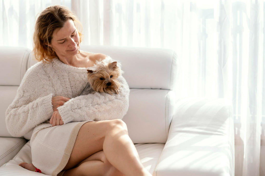 woman-cuddling-small-dog