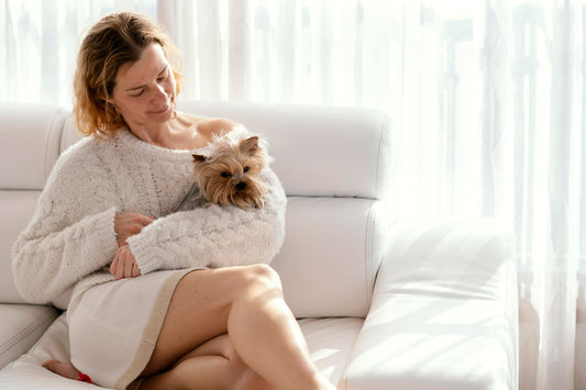 woman-cuddling-small-dog